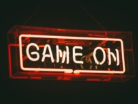 red and white Game On LED signage