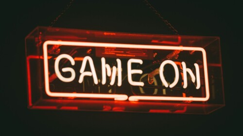 red and white Game On LED signage