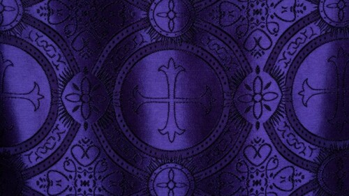 purple and white cross-print textile